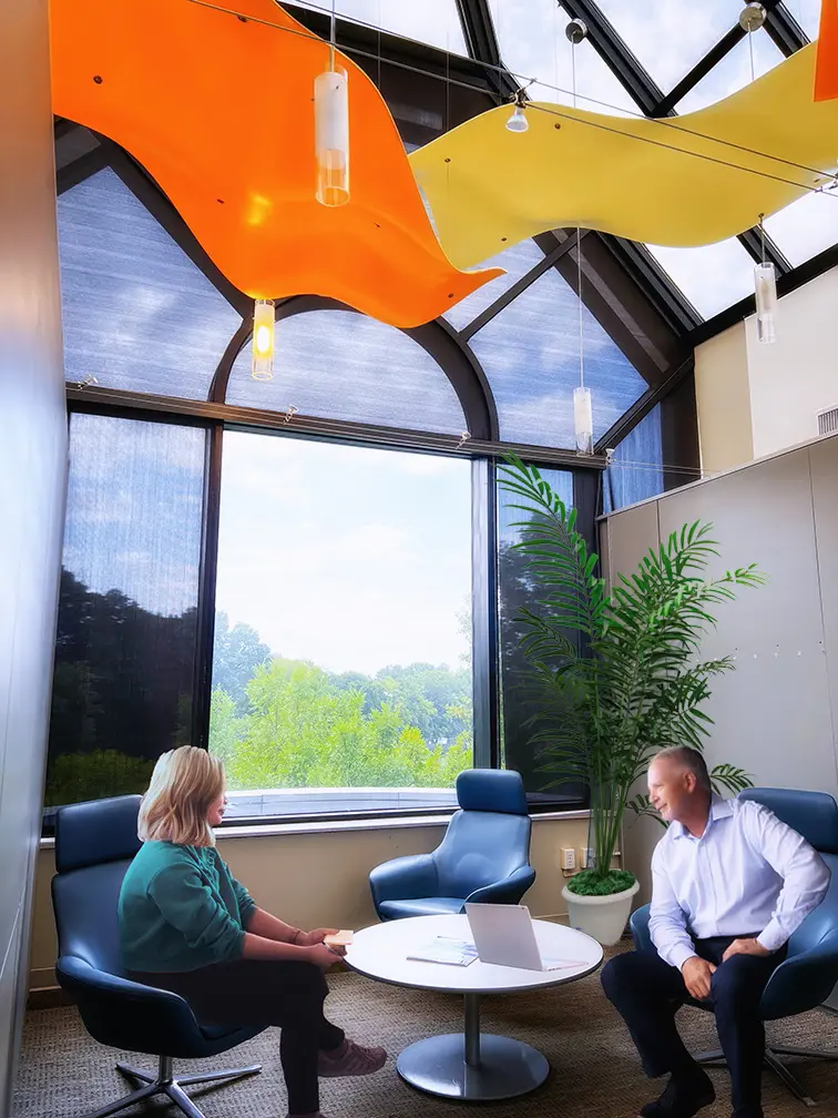 MCC Suites coworking shared huddle space with colorful modern design and lots of sunlight